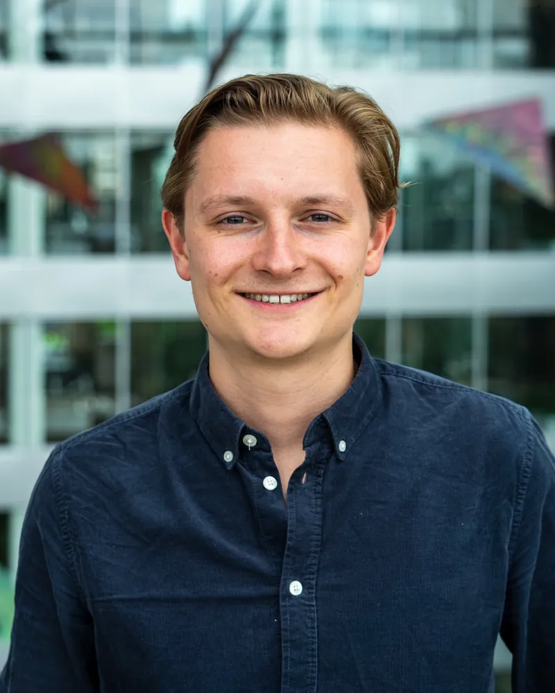 Erik Overweter, founder of Chuw, smiling, in a dark blue shirt